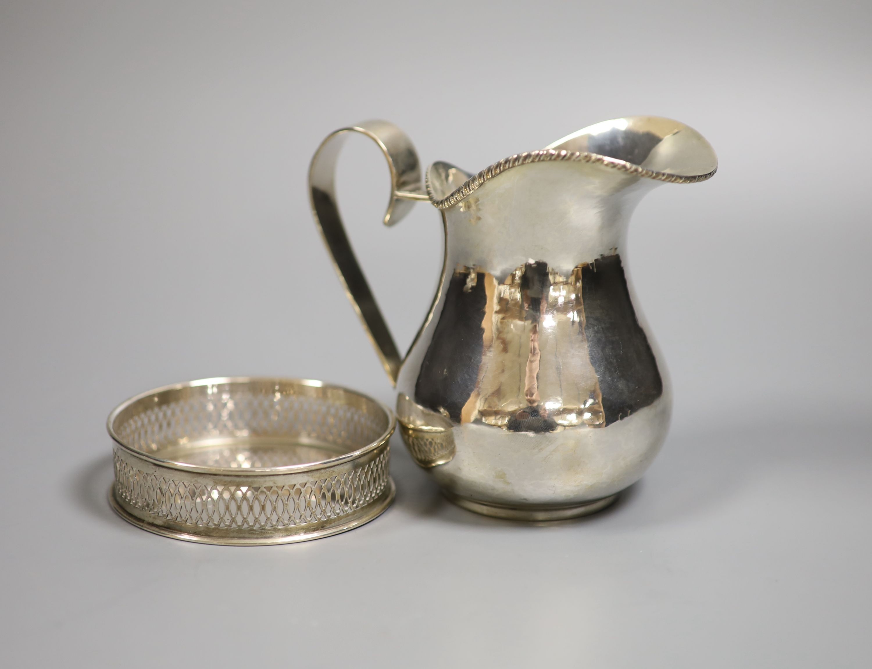 A Continental 800 standard silver jug, a bowl and an 800 standard bottle coaster, gross 12.5oz.